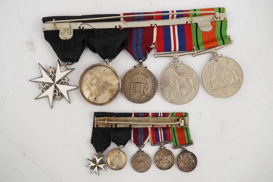 A WWII and later medal group of five medals, together with its miniature set, comprising; The Defence Medal, the 1939-1945 medal, the ERII Coronation medal, and two St. John’s Ambulance Service medals. Condition - fair t